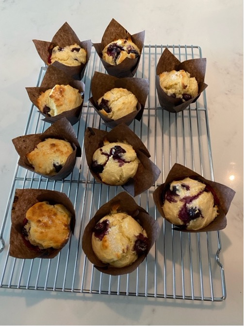 A group of muffins on a
            cooling rackDescription automatically generated